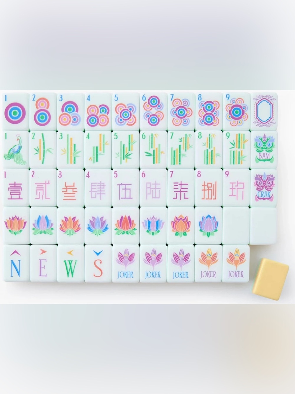 Pastel Yellow Mahjong Tile Set with Multicolor Floral and Symbol Accents